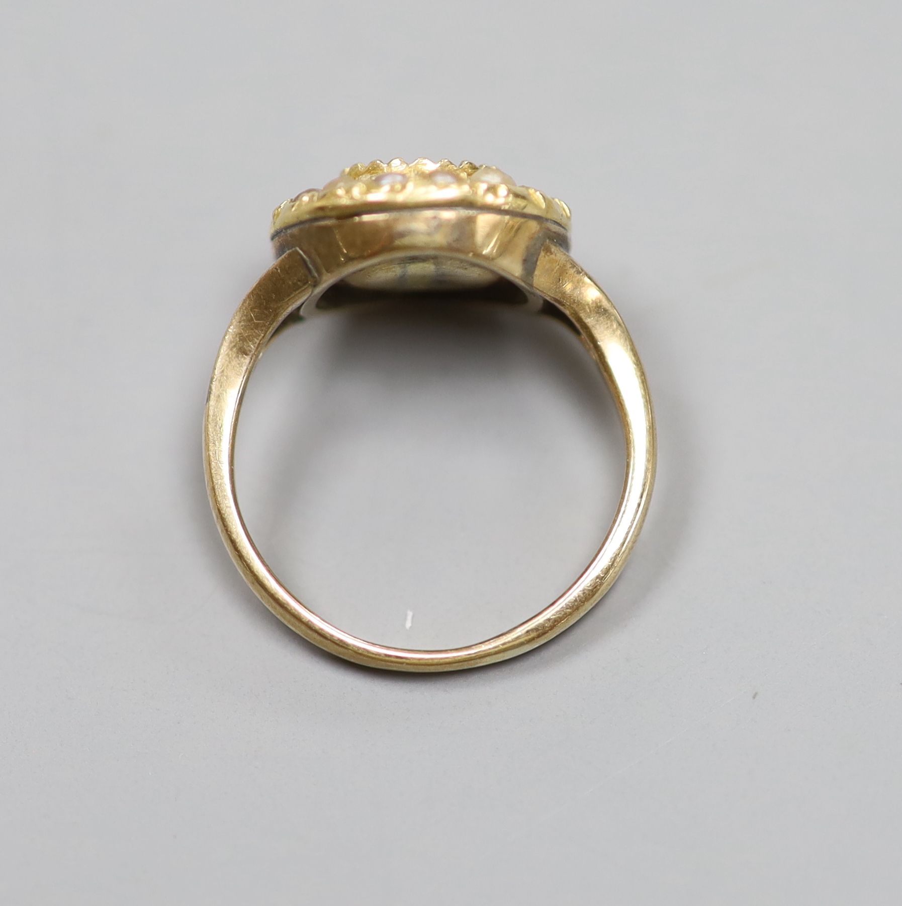 A 9ct, citrine and seed pearl set circular cluster ring